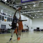 Battle for the ball between Iggy Hunte and Matthew McGrath