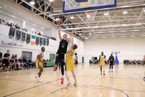 Cian Sullivan hooks in a basket over Eoin McCann