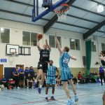 Daniel Jokubaitis rises high to score over Eoin Nelson