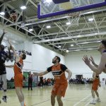 Iggy Hunte floats in a two pointer over Matthew McGrath