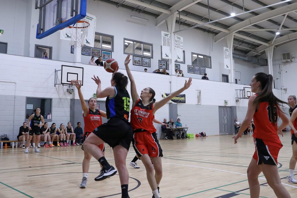 Meábh Barry scores despite the efforts of Emma Kerin