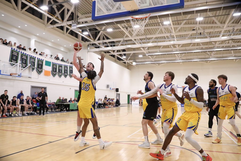 Padraig Fleming banks in a score over Will Thomas