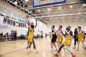 Padraig Fleming banks in a score over Will Thomas