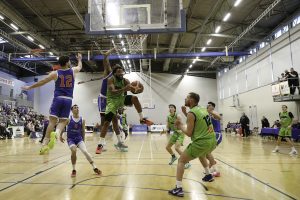 Jordan Perkins in a tight spot under the Demons board