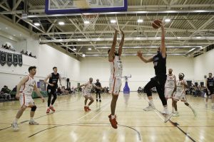 Daniel Jokuabitis finishes over Ballincollig's Latavious Mitchell