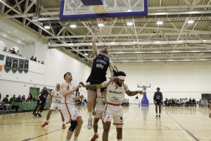 Eoin Quigley scores with a little help from Ballincollig's Latrell Jossell