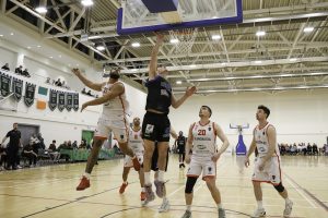 Steven Bowler does it alone as the Ballincollig team look on