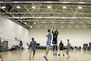 Iggy Hunte floats in a score over Neptune's Eoin Nelson