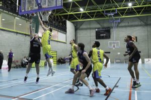 Padraig Fleming banks in a score over Marian s Tanner Graham